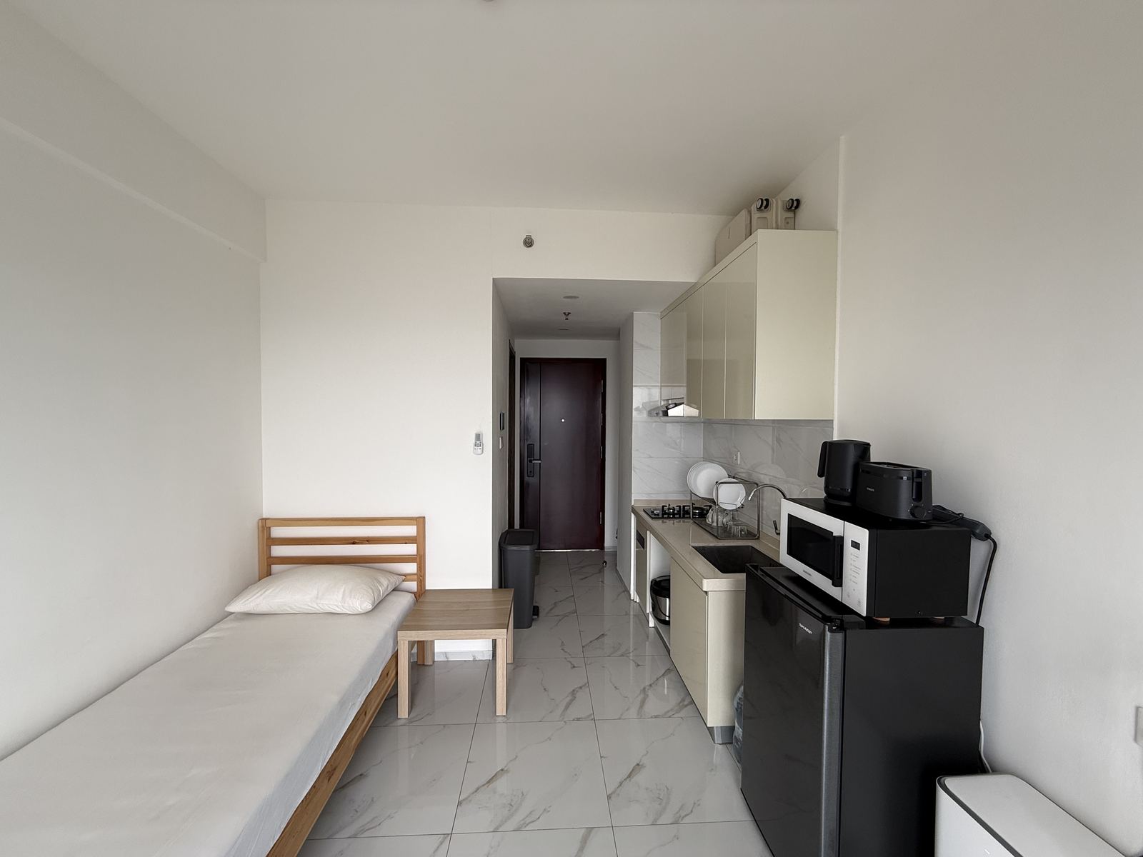 Area tidur studio 24,43 m² SkyHouse BSD Kensington